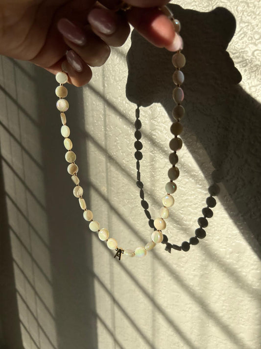 Flat pearl with letter